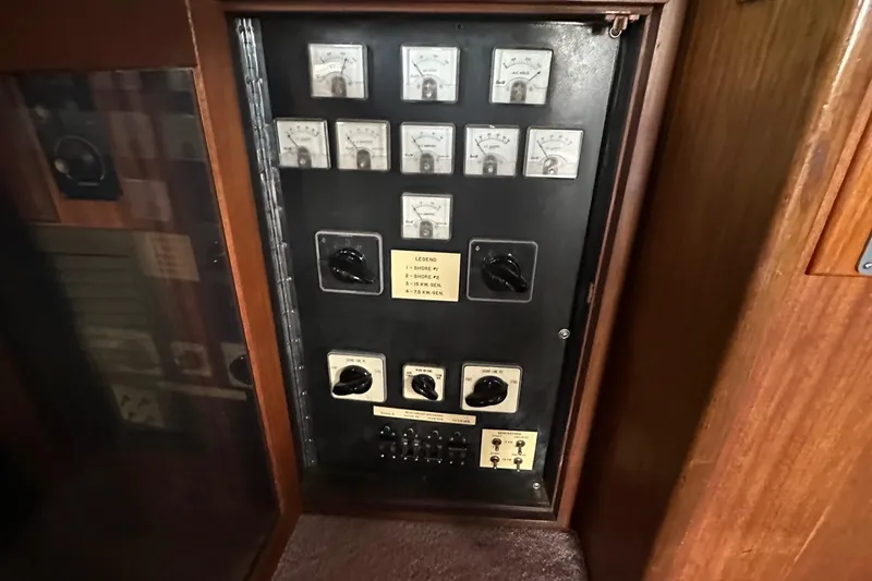 Slide: The Image of Electrical panel of a 1974 Hatteras 58 Yachtfish with gauges and switches. - 5