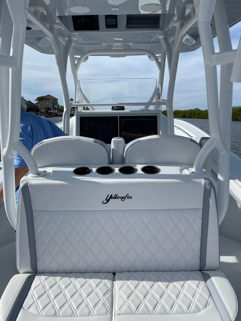 Slide: The Image of 2022 Yellowfin 34 boat interior with white seating and console. - 16