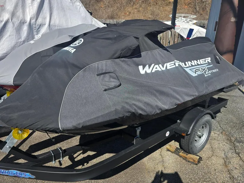 Slide: The Image of 2021 Yamaha WaveRunner FX Limited SVHO covered on trailer, outdoor setting. - 10