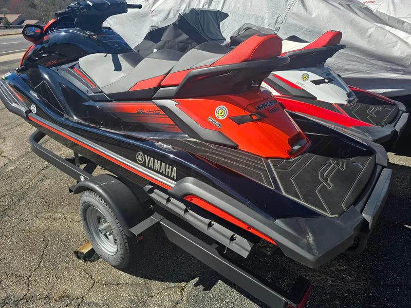 Slide: The Image of 2021 Yamaha WaveRunner FX Limited SVHO on trailer, featuring sleek red and black design. - 2