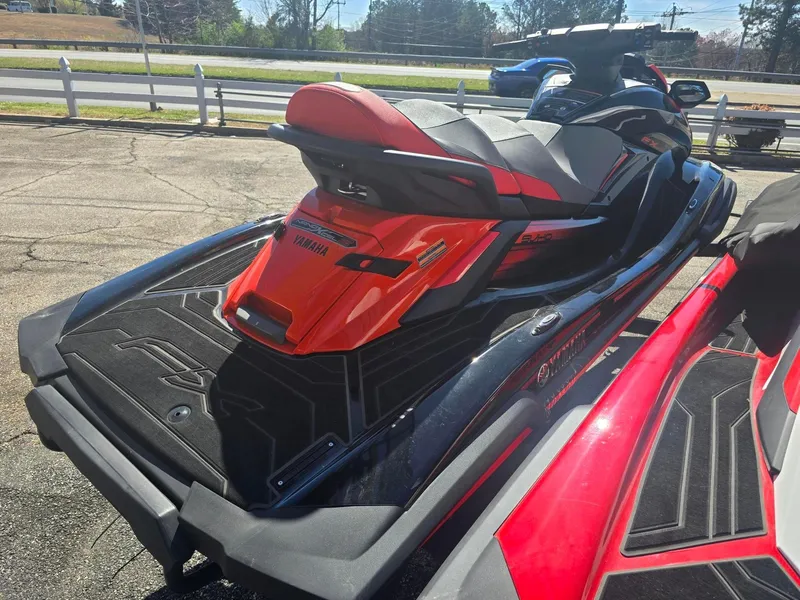 Slide: The Image of 2021 Yamaha WaveRunner FX Limited SVHO in vibrant red and black, parked outdoors. - 3
