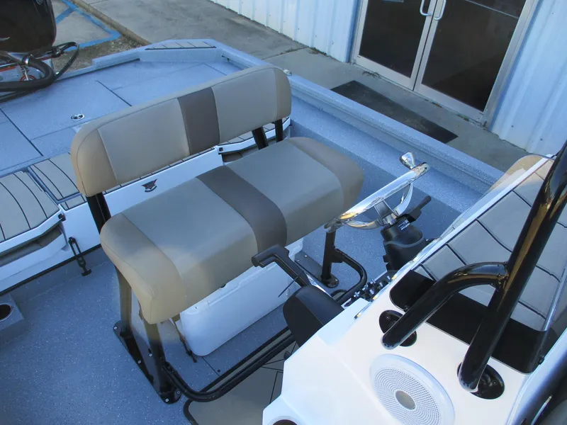 Slide: The Image of 2025 Vexus ACX 2210 boat interior with dual-tone seating and steering console. - 11
