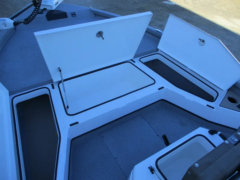 Slide: The Image of 2025 Vexus ACX 2210 boat interior with open storage compartments. - 13
