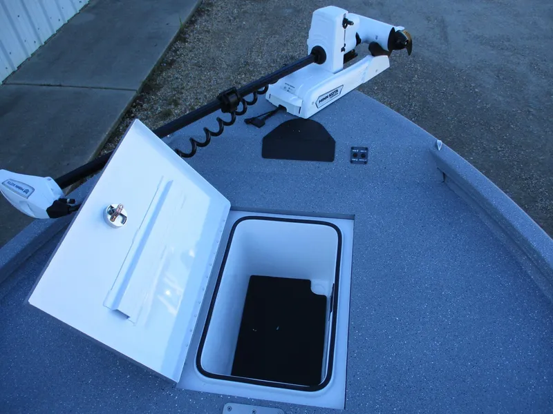 Slide: The Image of 2025 Vexus ACX 2210 boat with open storage compartment and trolling motor. - 14