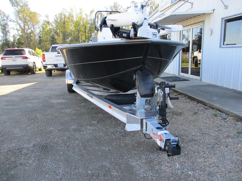 Slide: The Image of 2025 Vexus ACX 2210 boat on trailer outside dealership. - 2