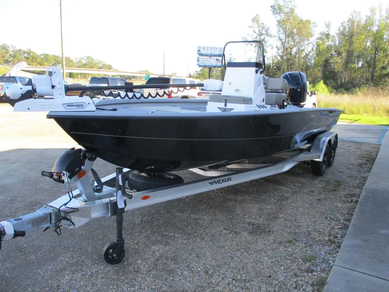 Slide: The Image of 2025 Vexus ACX 2210 boat on trailer, parked outdoors. - 4