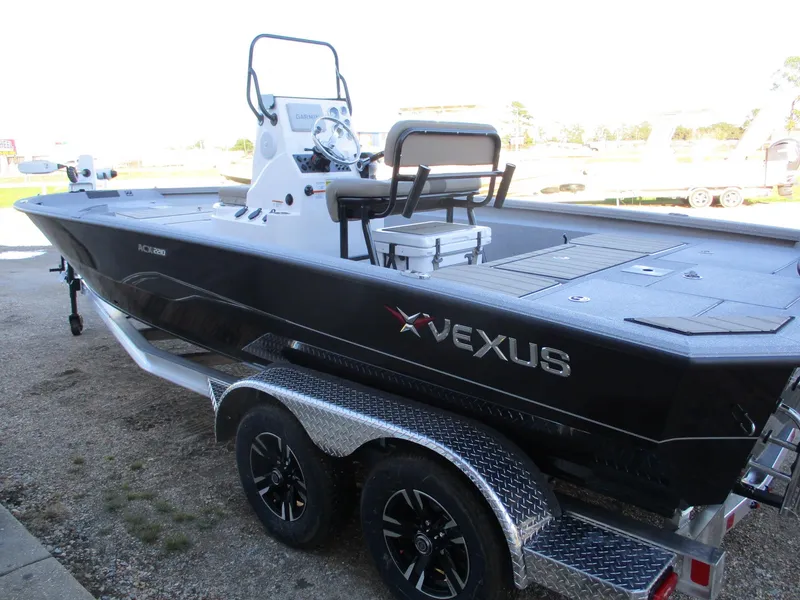 Slide: The Image of 2025 Vexus ACX 2210 boat on trailer, side view, black exterior. - 6