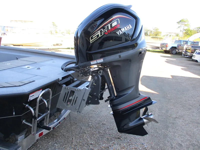 Slide: The Image of 2025 Vexus ACX 2210 boat with Yamaha SHO outboard motor, parked on a trailer. - 7