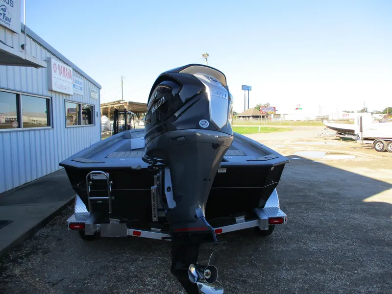 Slide: The Image of 2025 Vexus ACX 2210 boat on trailer, rear view with outboard motor. - 8