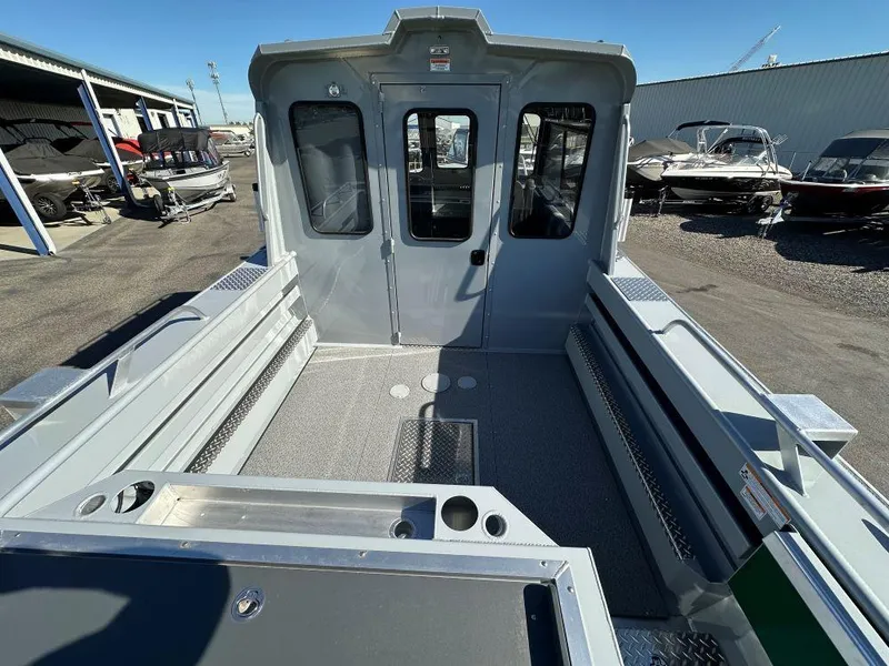 Slide: The Image of 2025 Hewescraft 220 Ocean Pro ET HT boat interior, spacious deck, and modern design. - 4