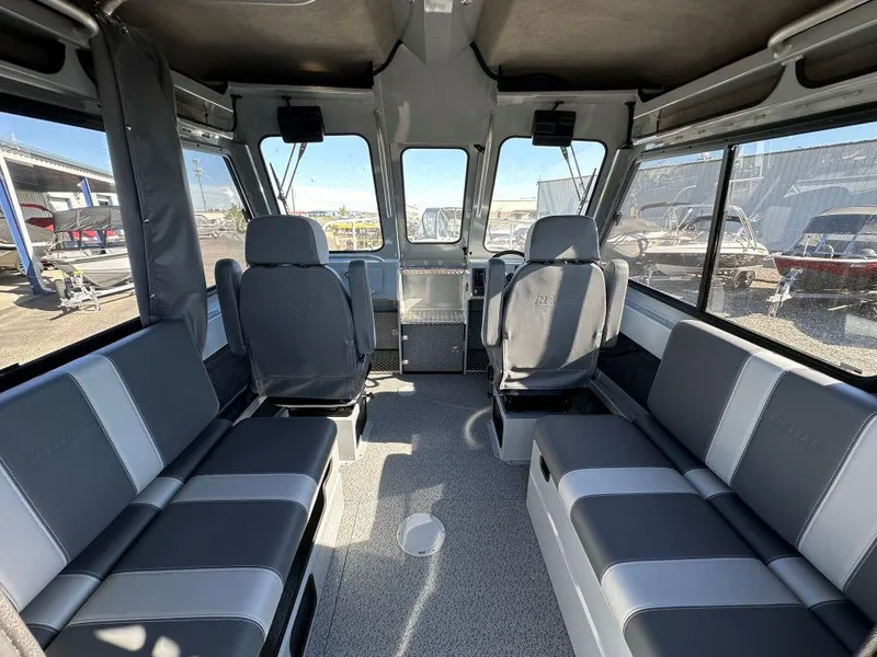 Slide: The Image of Interior of 2025 Hewescraft 220 Ocean Pro ET HT boat, featuring spacious seating and modern design. - 5