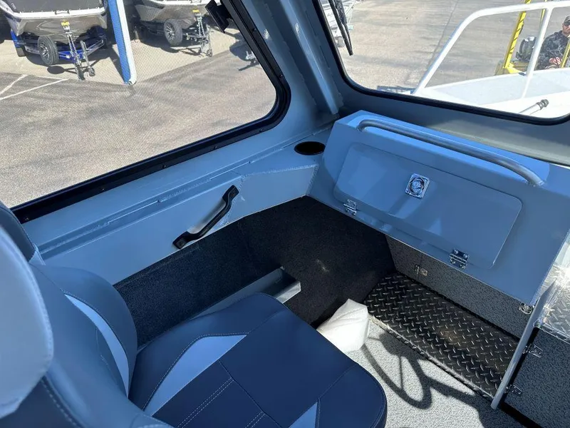 Slide: The Image of Interior of 2025 Hewescraft 220 Ocean Pro ET HT boat, featuring seating and storage. - 7
