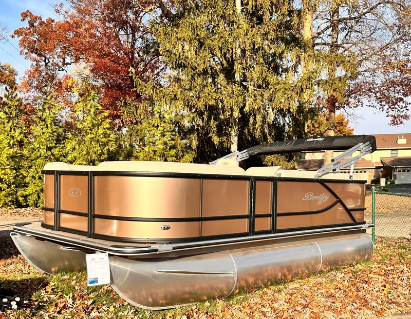 Slide: The Image of 2025 Bentley Pontoons LE 160CR in a scenic autumn setting. - 1