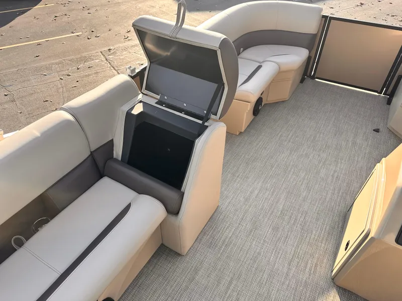 Slide: The Image of 2025 Bentley Pontoons LE 160CR interior with open storage compartment. - 10