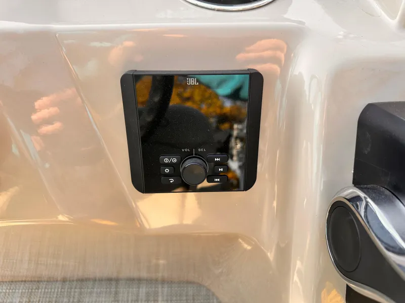 Slide: The Image of JBL audio control panel on 2025 Bentley Pontoons LE 160CR boat dashboard. - 13