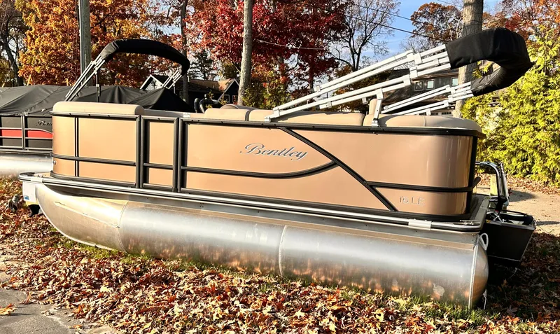 Slide: The Image of 2025 Bentley Pontoons LE 160CR in autumn setting, showcasing sleek design and luxury features. - 3