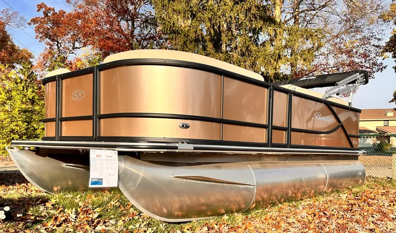 Slide: The Image of 2025 Bentley Pontoons LE 160CR pontoon boat in a scenic autumn setting. - 6