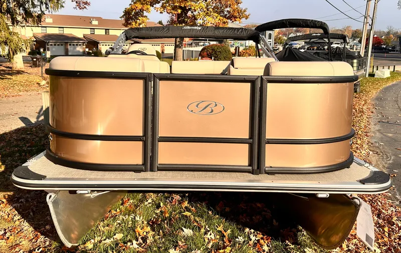 Slide: The Image of 2025 Bentley Pontoons LE 160CR, bronze exterior, parked outdoors in autumn setting. - 7