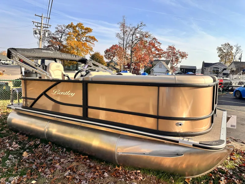 Slide: The Image of 2025 Bentley Pontoons LE 160CR in autumn setting, showcasing sleek design and luxury features. - 8