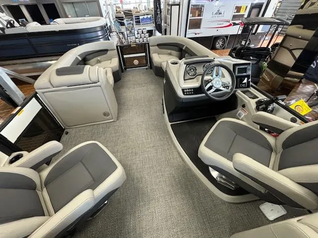Slide: The Image of 2025 Barletta Cabrio 22 QC pontoon boat interior with modern seating and steering console. - 12