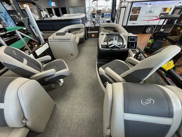Slide: The Image of 2025 Barletta Cabrio 22 QC pontoon boat interior with luxurious seating and modern dashboard. - 13