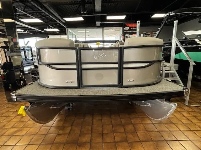 Slide: The Image of 2025 Barletta Cabrio 22 QC pontoon boat displayed in showroom. - 20