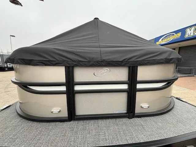 Slide: The Image of 2025 Barletta Cabrio 22 QC pontoon boat with black cover, displayed outdoors. - 21