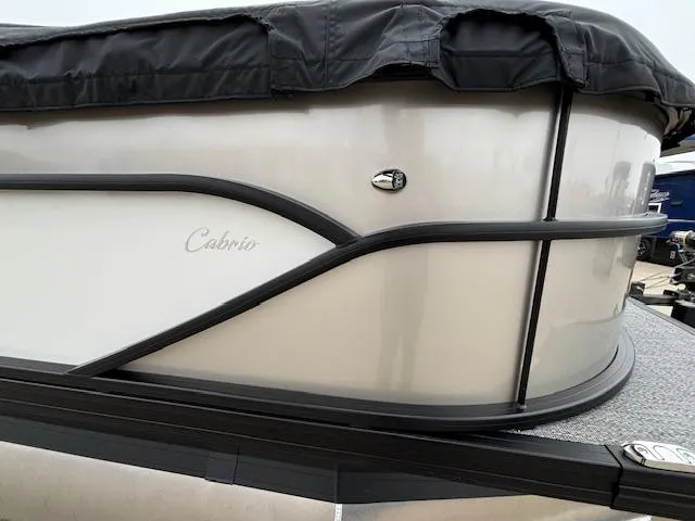 Slide: The Image of 2025 Barletta Cabrio 22 QC pontoon boat with protective cover. - 22
