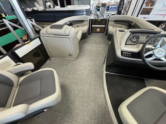 Slide: The Image of 2025 Barletta Cabrio 22 QC interior with modern seating and sleek dashboard design. - 6