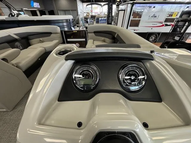 Slide: The Image of 2025 Barletta Cabrio 22 QC boat interior with modern dashboard and seating. - 7