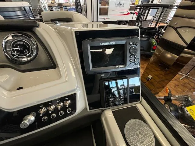 Slide: The Image of 2025 Barletta Cabrio 22 QC dashboard with Lowrance navigation system and control panel. - 8