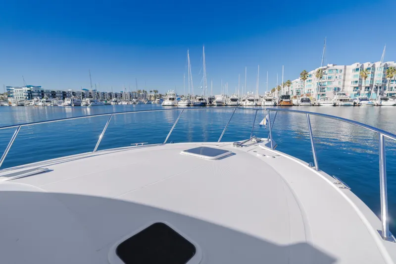 Slide: The Image of View from 2006 Rampage 38 Express yacht in a marina, clear blue sky. - 33