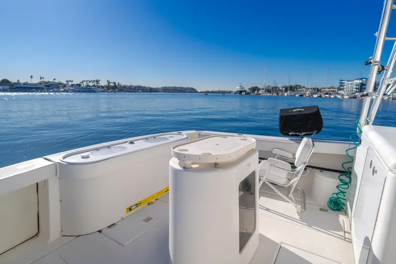 Slide: The Image of 2006 Rampage 38 Express boat deck with ocean view and clear blue sky. - 35