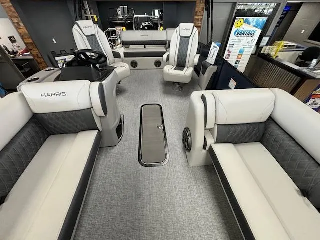 Slide: The Image of 2025 Harris SUNLINER 230 SLDH pontoon boat interior with plush seating and modern design. - 11