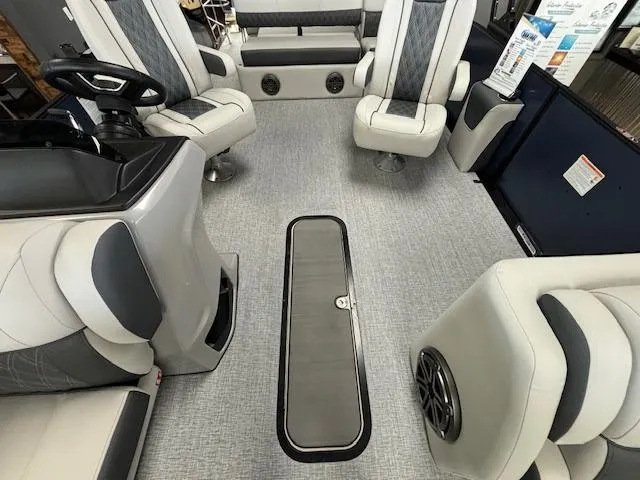 Slide: The Image of 2025 Harris SUNLINER 230 SLDH boat interior with modern seating and sleek design. - 15