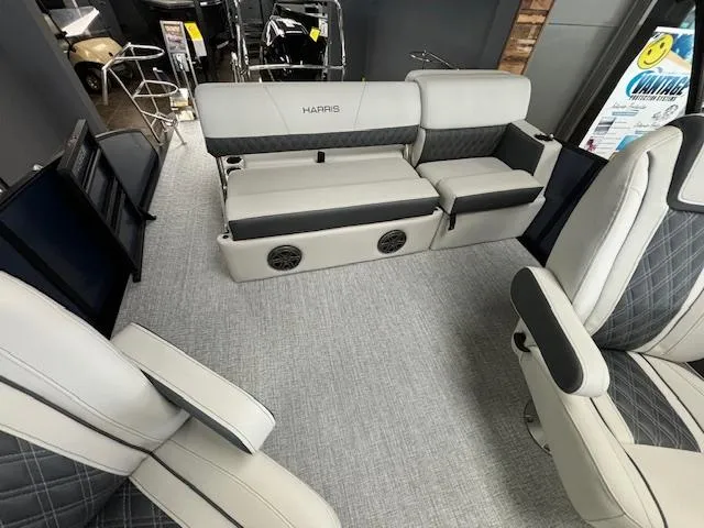 Slide: The Image of 2025 Harris SUNLINER 230 SLDH boat interior with modern seating and stylish design. - 17