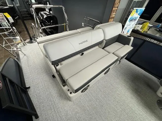 Slide: The Image of 2025 Harris SUNLINER 230 SLDH boat interior with sleek, modern seating design. - 18