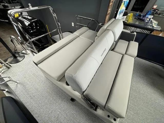 Slide: The Image of 2025 Harris SUNLINER 230 SLDH boat interior with plush seating and modern design. - 20