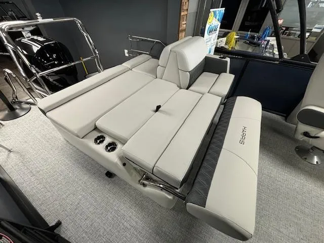 Slide: The Image of 2025 Harris SUNLINER 230 SLDH boat interior with luxurious seating and modern design. - 22