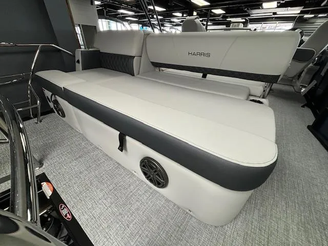 Slide: The Image of 2025 Harris SUNLINER 230 SLDH boat interior with sleek seating and modern design. - 23