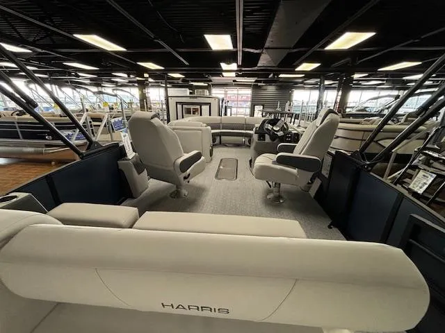 Slide: The Image of 2025 Harris SUNLINER 230 SLDH pontoon boat interior with plush seating and modern design. - 25