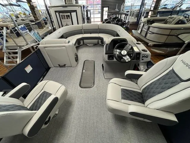 Slide: The Image of 2025 Harris SUNLINER 230 SLDH pontoon boat interior with plush seating and modern helm. - 27