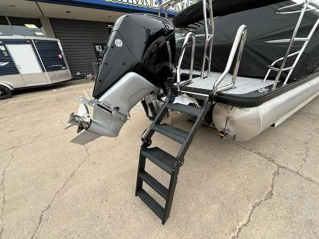 Slide: The Image of 2025 Harris SUNLINER 230 SLDH boat with outboard motor and boarding ladder. - 5