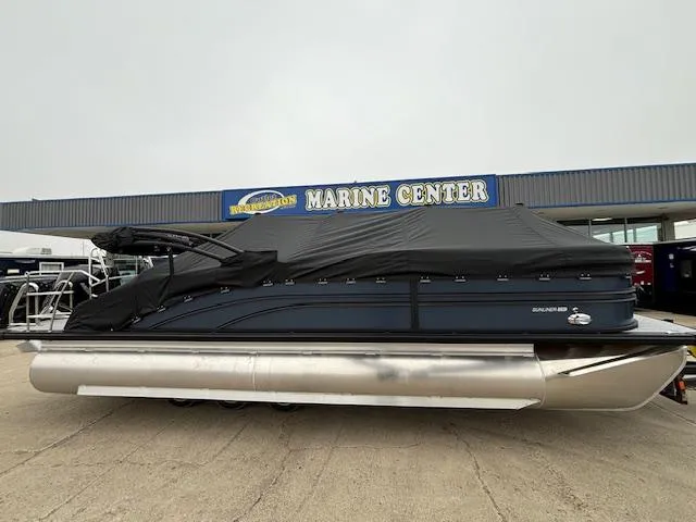 Slide: The Image of 2025 Harris SUNLINER 230 SLDH pontoon boat covered at a marine center. - 6