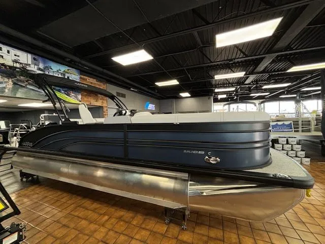 Slide: The Image of 2025 Harris SUNLINER 230 SLDH pontoon boat displayed in showroom. - 8