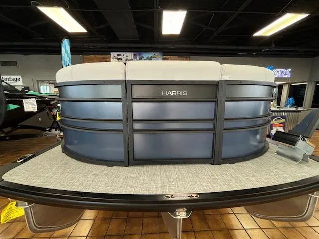 Slide: The Image of 2025 Harris SUNLINER 230 SLDH pontoon boat in showroom, front view. - 9