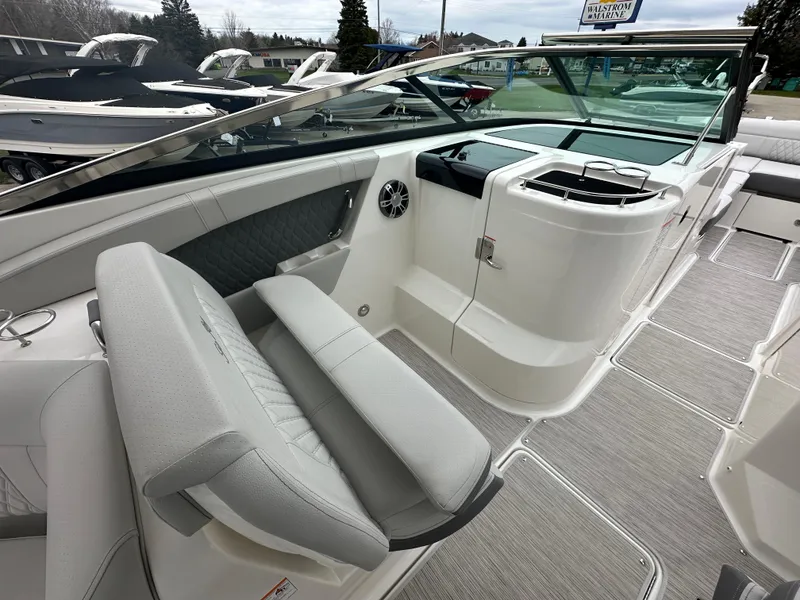 Slide: The Image of 2025 Sea Ray SLX 350 boat interior with sleek seating and modern design. - 11