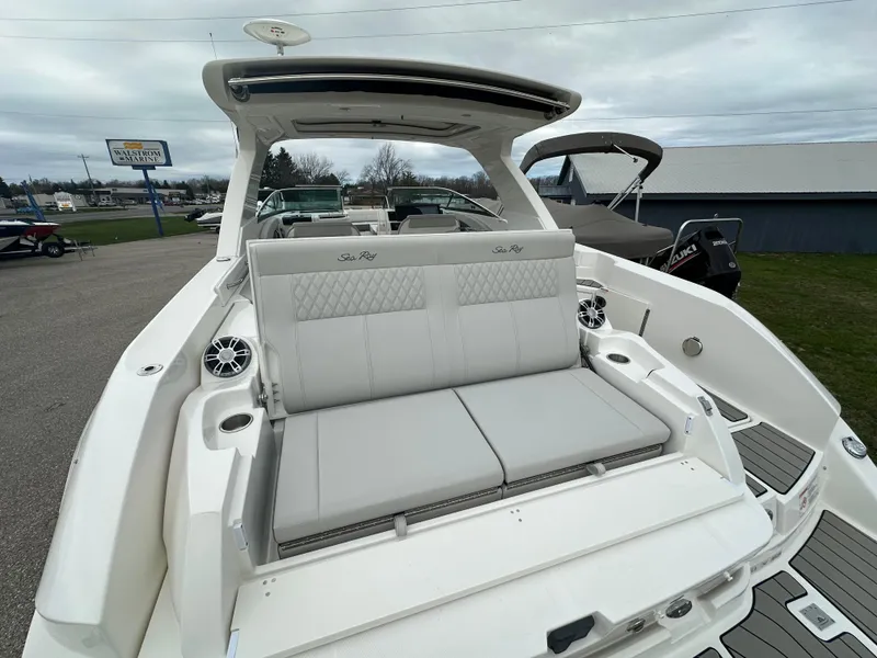 Slide: The Image of 2025 Sea Ray SLX 350 boat with luxurious seating and modern design. - 16