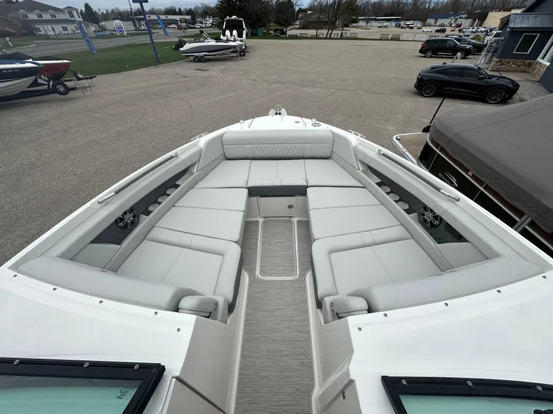 Slide: The Image of 2025 Sea Ray SLX 350 boat with spacious bow seating and modern design. - 4