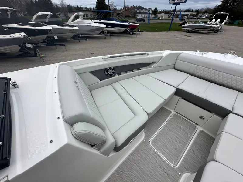 Slide: The Image of 2025 Sea Ray SLX 350 boat with luxurious seating and modern design. - 5